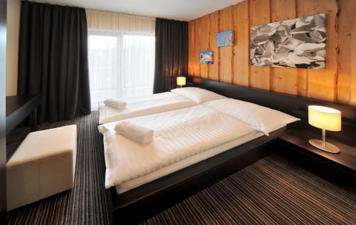 Posteľ alebo postele v izbe v ubytovaní Via Jasna Wellness Apartments