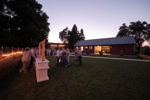 a group of people standing in front of a building at The Setting Inn Napa Valley in Napa