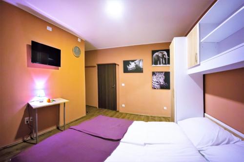 Ένα ή περισσότερα κρεβάτια σε δωμάτιο στο City Break Rooms Zagreb