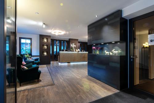 a lobby with a waiting room and a lobby with a lobby at Mirabeau Alpine in Zermatt
