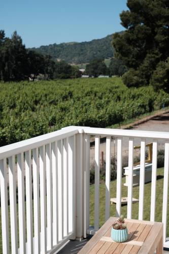 a potted plant sitting on a wooden table on a porch at The Setting Inn Napa Valley in Napa