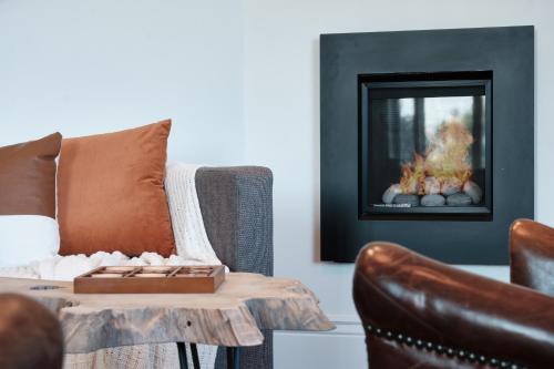 a living room with a couch and a table at The Setting Inn Napa Valley in Napa