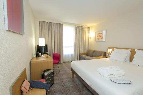 Novotel Perpignan Nord Rivesaltesにあるベッド
