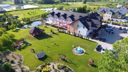 an aerial view of a house with a large yard at Hotel Restauracja LORENZO in Stopnica