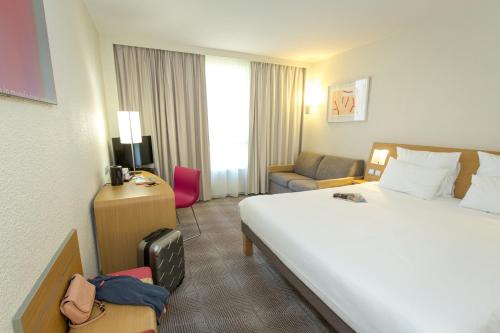 Novotel Perpignan Nord Rivesaltesにあるベッド