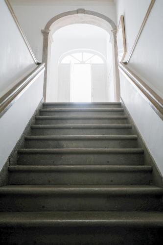 a staircase leading up to a building with a stair case at São Paulo Boutique Hotel - SPBH in Tavira