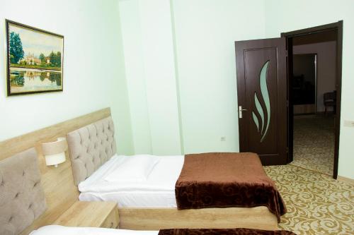 Cama o camas de una habitación en Hotel Grand