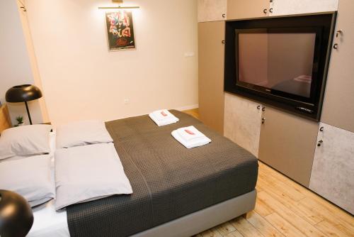Cama o camas de una habitación en Apartman Donner Centar II