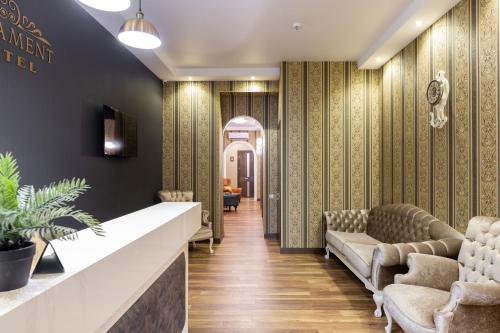a lobby with chairs and a waiting room at Ornament Hotel in Tbilisi City