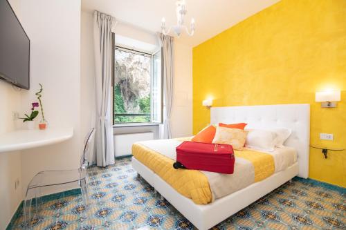 Säng eller sängar i ett rum på Valle d'Amalfi Suites