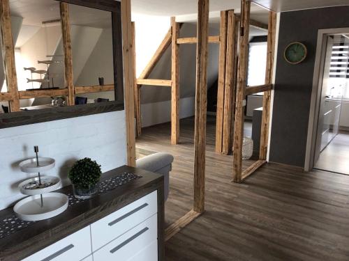a bathroom with a sink and a mirror at Fewo-Am-Hahnenberg in Goslar