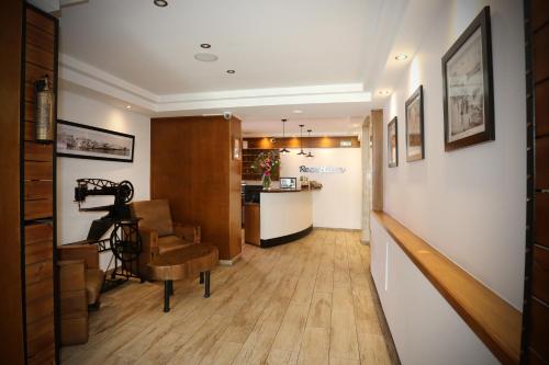 a hallway with a stairway leading to a living room at Pier Beach Hotel Apartments in Limassol