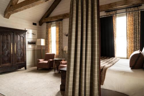 a bedroom with a bed and a desk and a chair at Eleven Scarp Ridge Lodge in Crested Butte