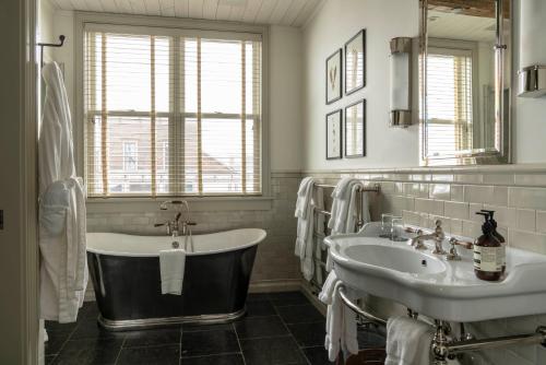 a bathroom with a tub and a sink at Eleven Scarp Ridge Lodge in Crested Butte