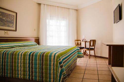Cama ou camas em um quarto em Catussaba Resort Hotel