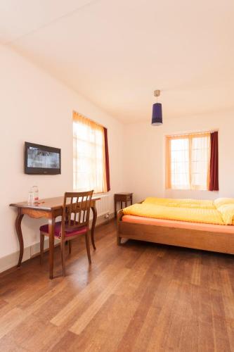 Postel nebo postele na pokoji v ubytování Kulturhotel Guggenheim