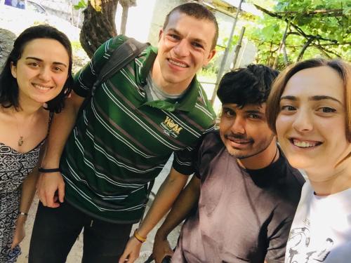 a group of people posing for a picture at Butichi Guest House in Chiatʼura