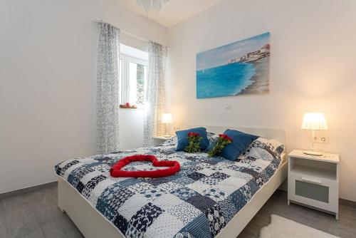 Postel nebo postele na pokoji v ubytování Apartments Luksic