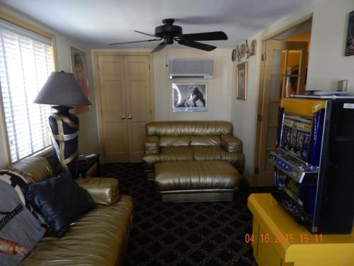 a living room with a couch and a television at Summer Nites in North Wildwood
