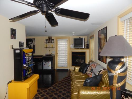 a living room with a couch and a ceiling fan at Summer Nites in North Wildwood
