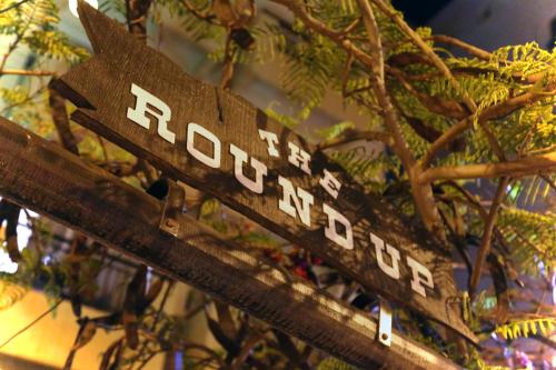 a wooden sign with the word foreclosure on it at Pier Beach Hotel Apartments in Limassol