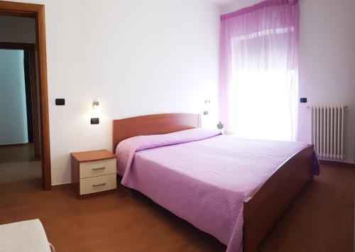 A bed or beds in a room at SeaSide Apartment