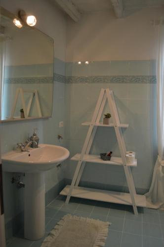 a bathroom with a sink and a mirror at B&B Casa Rachele in Pianello Val Tidone