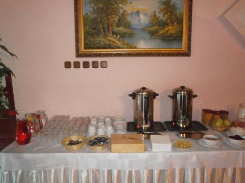 a table with a white table cloth with food on it at ABC Hotel Nitra in Nitra