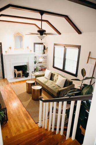 a living room with a couch and a fireplace at The Paddock Luxury Vacation Home in Hot Springs