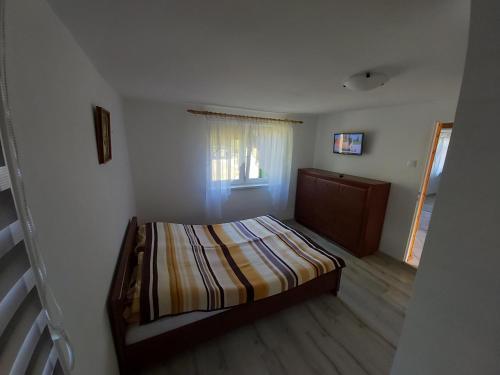 מיטה או מיטות בחדר ב-Agroturystyka Stajnia Horyzont