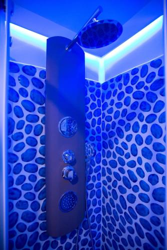 a blue shower in a bathroom with a blue floor at MARINELLA CASA VACANZE in Cetara
