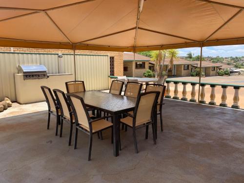 a black table and chairs on a patio at Bridge Street Motor Inn in Toowoomba