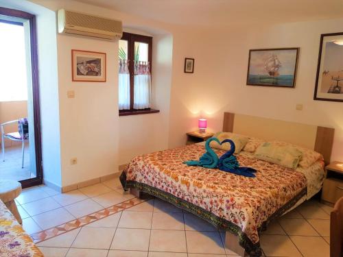 Ένα ή περισσότερα κρεβάτια σε δωμάτιο στο Apartment Noemi