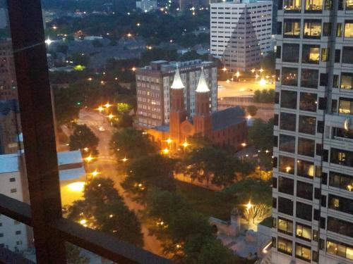 a view of a city at night with buildings at Peachtree Towers Condo in Atlanta