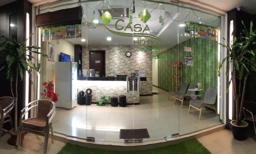 a lobby of a clinic with chairs and a counter at Casa Hotel near KLIA 1 in Sepang