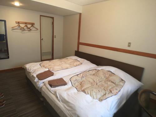 מיטה או מיטות בחדר ב-Hotel Nasu Otawara Hills