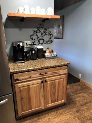 a kitchen with a counter top with a coffee maker at Drift Lodge in Island Park
