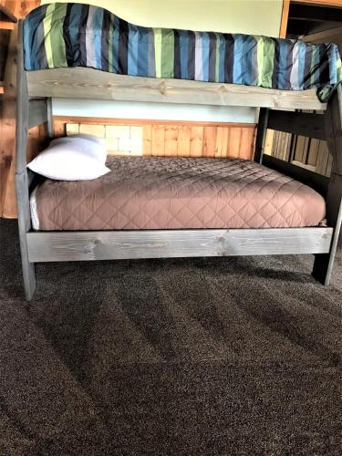 a wooden bunk bed in a room at Drift Lodge in Island Park