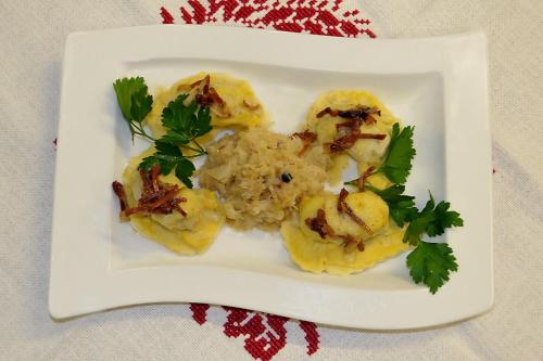 a plate of food with shrimp and rice on a table at Villa Bucher - Metnitztalerhof in Friesach