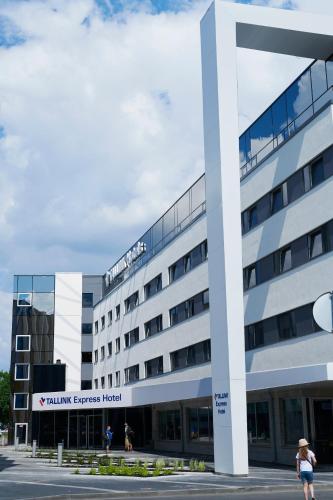 a building with a sign on top of it at Tallink Express Hotel in Tallinn