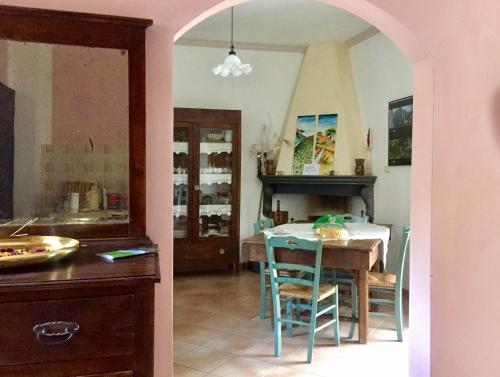 a kitchen and dining room with a table and chairs at Le Terrazze Sul Pollino B&B in Civita