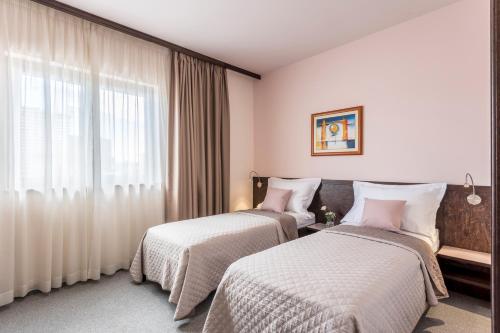 Una cama o camas en una habitación de Hotel As