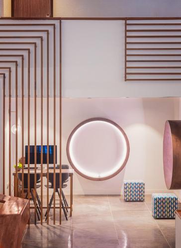 a dining room with a table and chairs at Cassia Hotel Jerusalem in Jerusalem