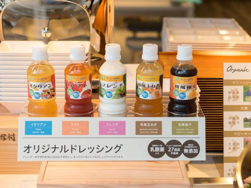 a display of bottles of honey on a counter at Super Hotel Anan Tomioka in Anan