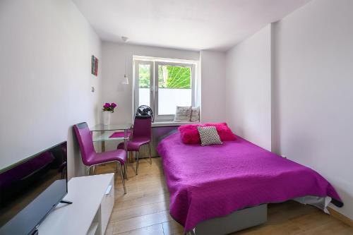 Postel nebo postele na pokoji v ubytování Apartament SYNERGIA