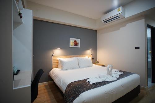 Katil atau katil-katil dalam bilik di Tisa Hotel Udonthani