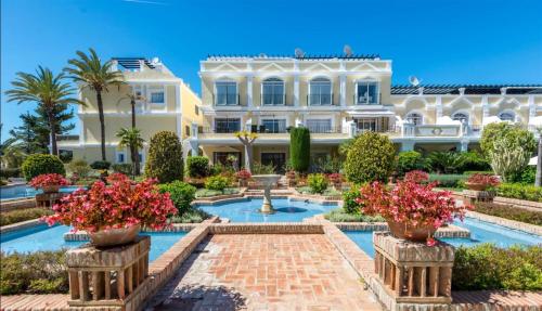 The swimming pool at or close to Aloha Gardens near Puerto Banus with breathtaking mountain view