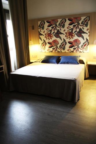 Postel nebo postele na pokoji v ubytování Hotel Ginebra