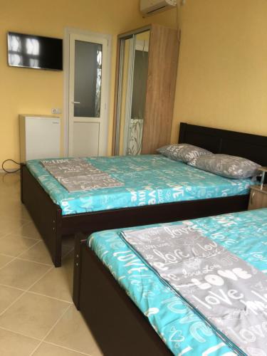 Postel nebo postele na pokoji v ubytování GRANAT Hotel