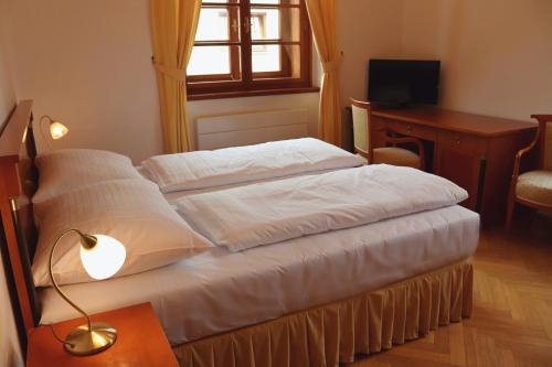 Wellness Hotel Zámečekにあるベッド
